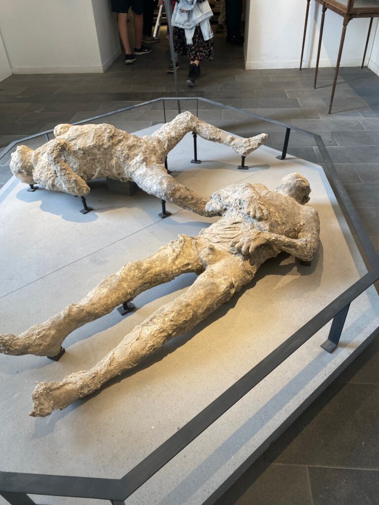 reconstructed casts of bodies found in Pompeii