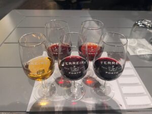 5 port wine glasses filled with port wine