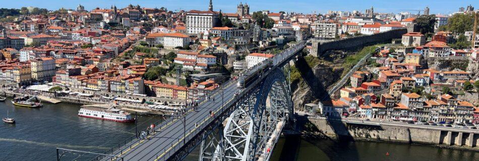Crossing the iconic Dom Luís I Bridge, a top pick for things to do in Porto